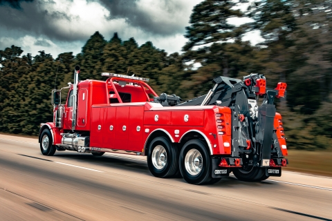 Century 5230 on a red peterbilt 589 chassis traveling on highway