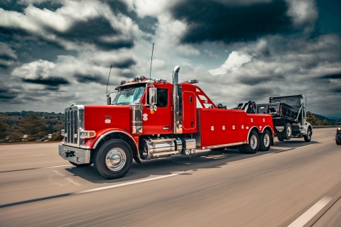 Century 5230 on a red peterbilt 589 chassis traveling on highway front shot